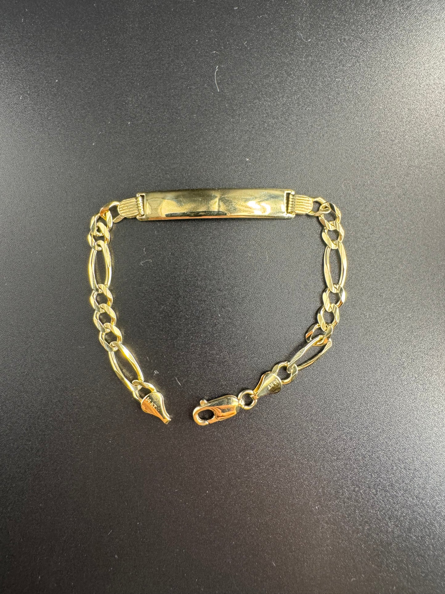 solid 14k yellow figaro with name plate bracelet